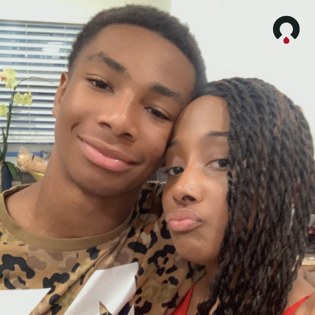 Alexandra, a sickle cell patient, with her son