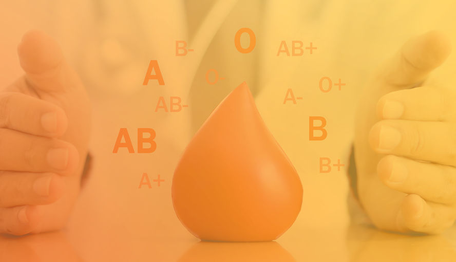 Graphic of a person in a lab coat holding their hands around a blood drop shape with different blood types circling around it