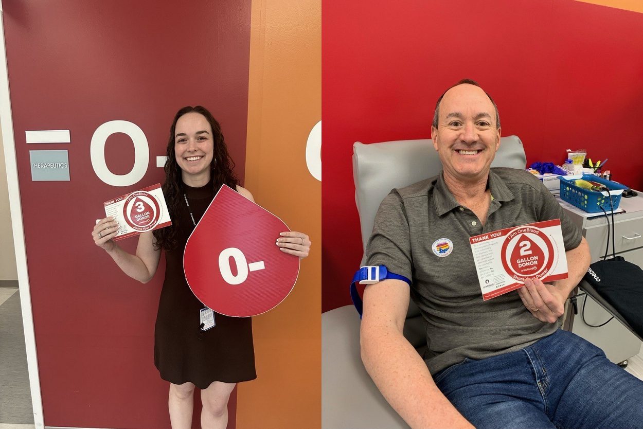 OneBlood donors, Caroline and George, showing off their gallon donation milestone stickers