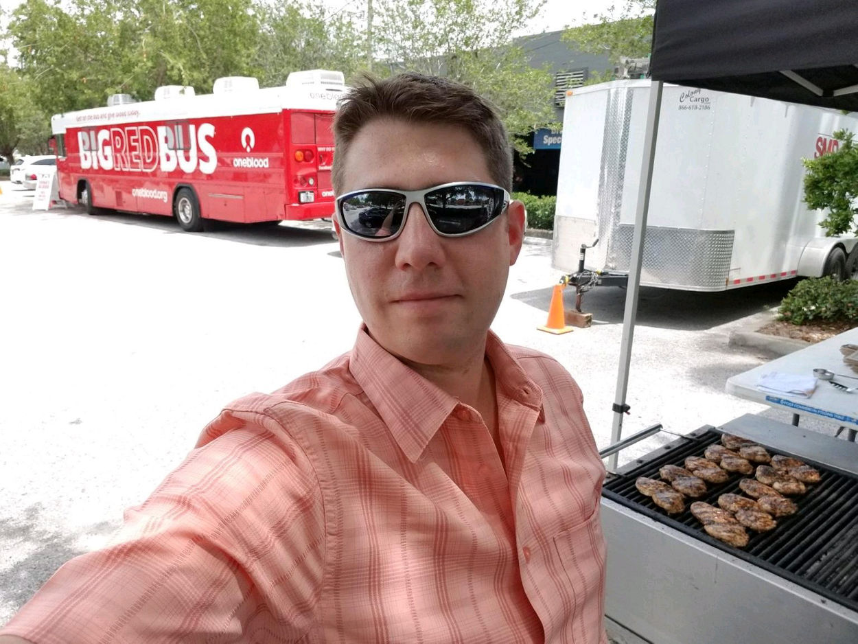 Carrabba’s Managing Partner Grilling at a Big Red Bus Carrabba’s Blood Drive