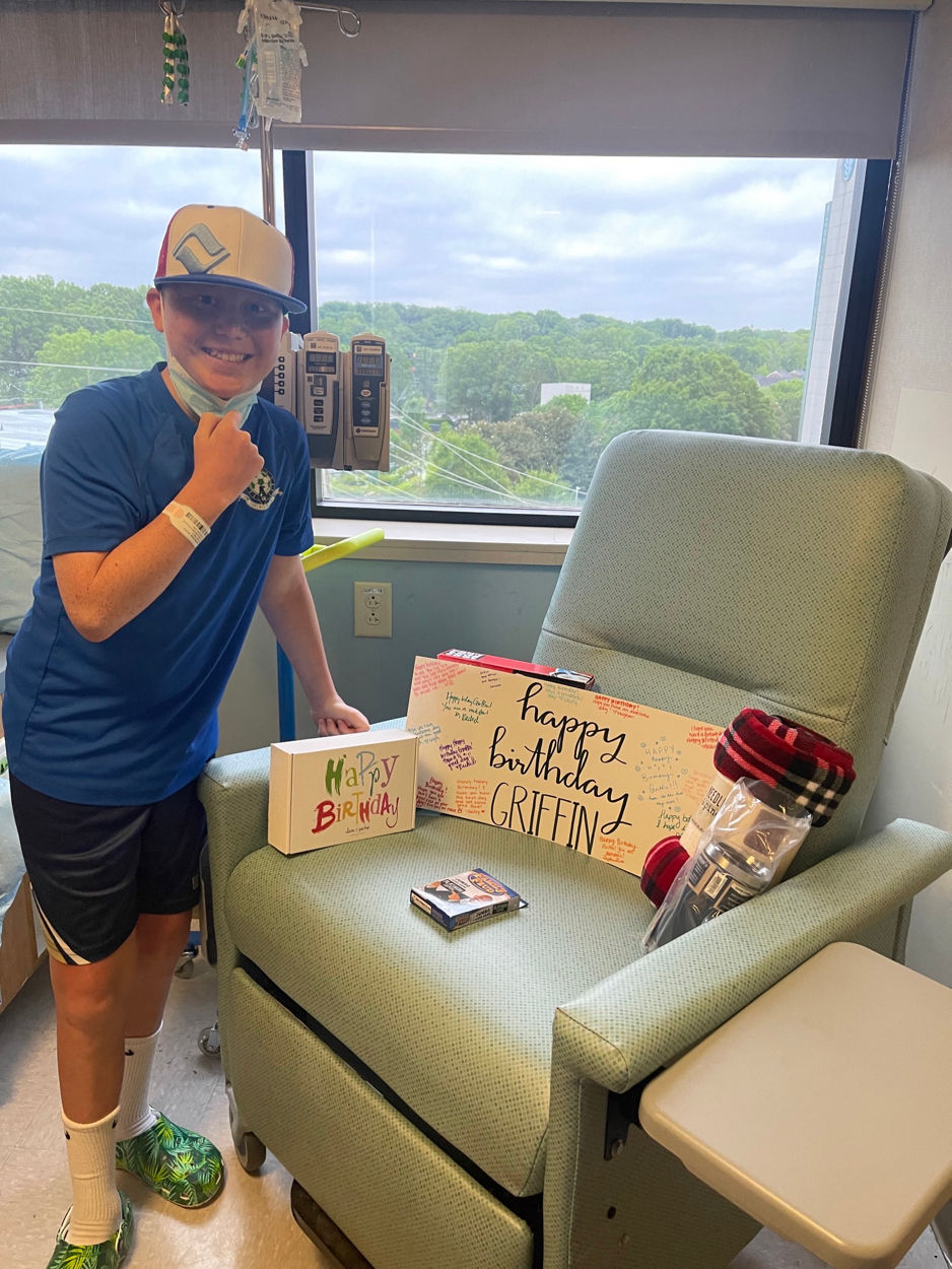 Griffin in the hospital with his birthday gifts
