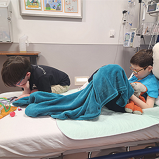 twin boys in hospital bed