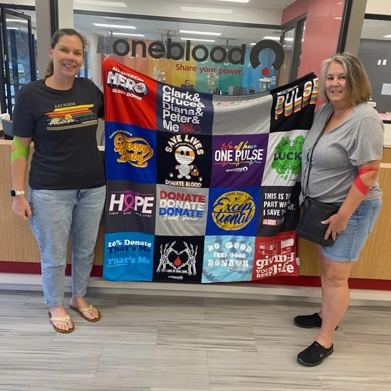 Linda S. and daughter holding T-shirt quilt image