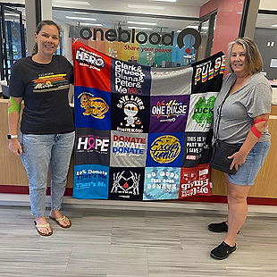 Linda S. and daughter holding T-shirt quilt image
