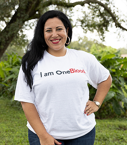 I am OneBlood Lucy in an I am OneBlood shirt