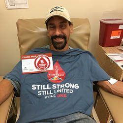 Matthew in donor chair with 5 gallon window cling