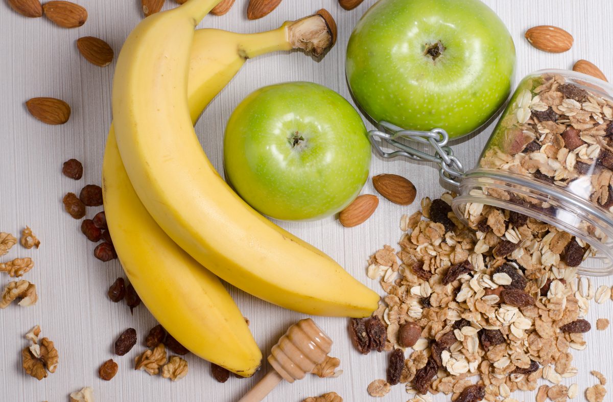 Bananas, apples, and granola, healthy low cholesterol snack alternatives