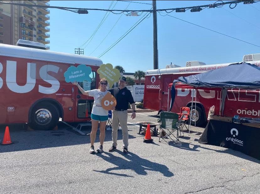 Taryn and Stu in front of the Big Red Bus image