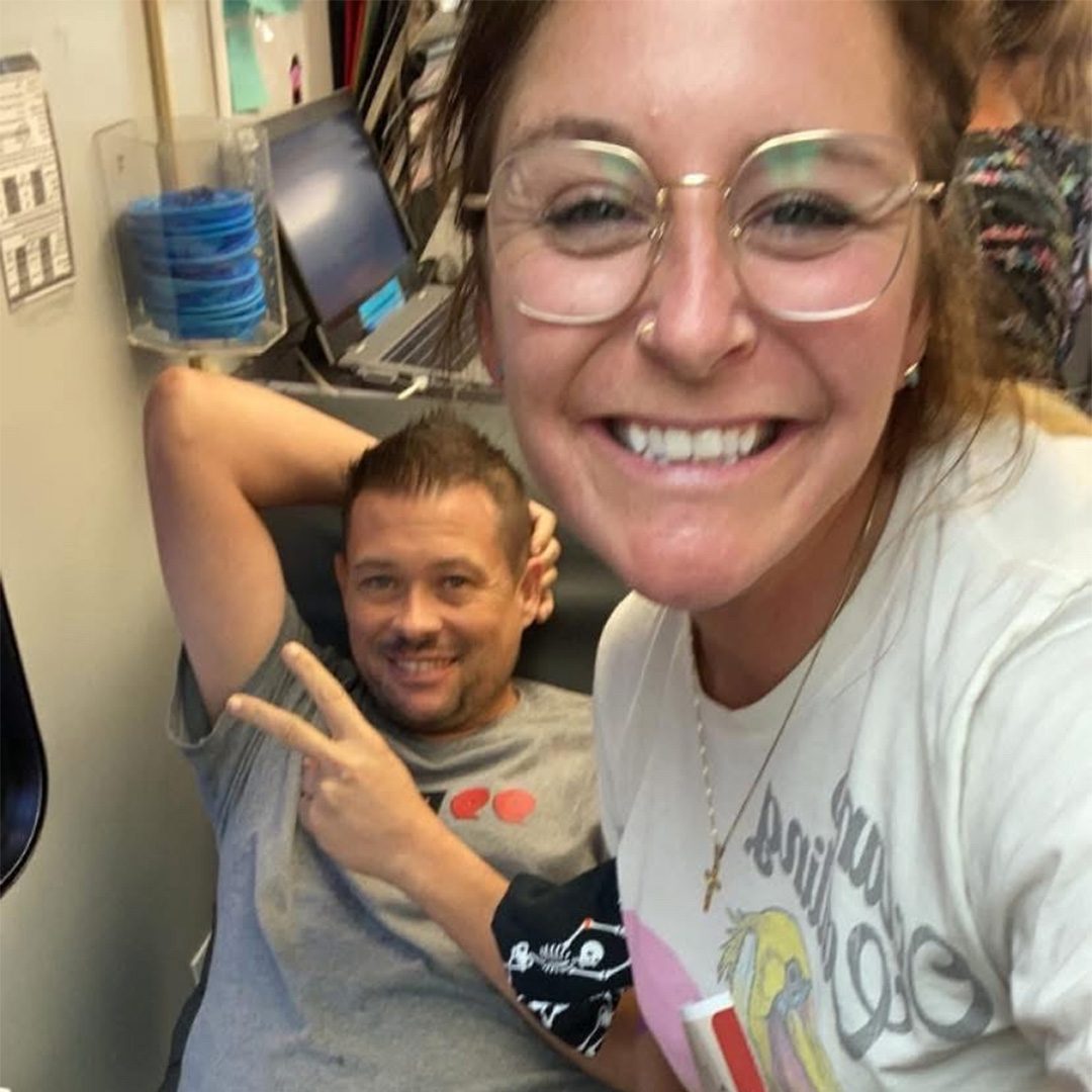 Taryn and radio partner on the Big Red Bus image