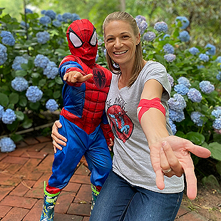 Trysta, a blood donation recipient, and her son in a Spiderman costume