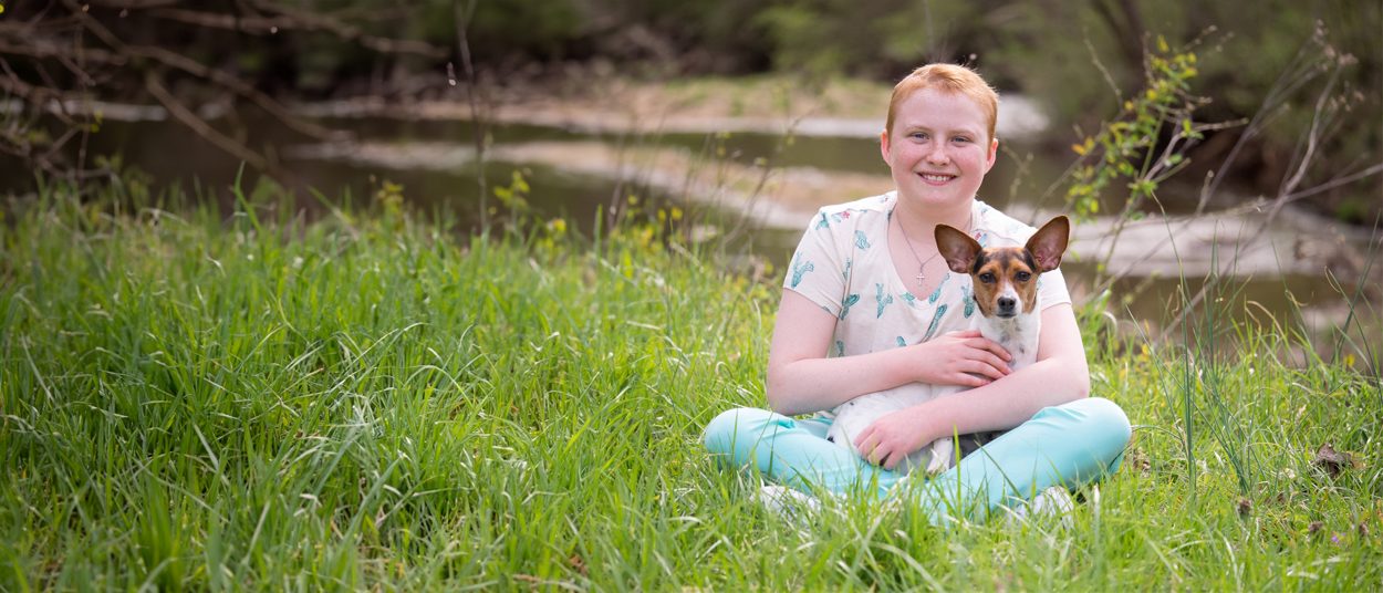 Avery holding her dog