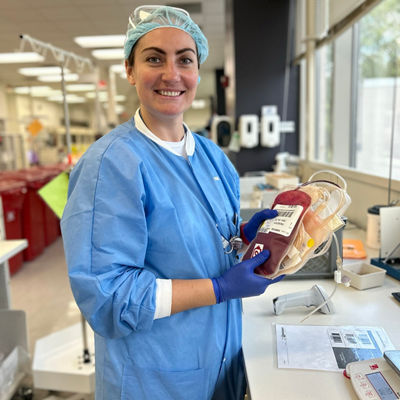 biologics assistant woman holding blood bags