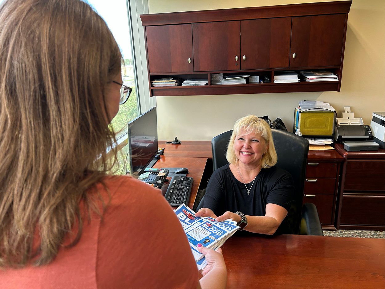 chair person receiving materials