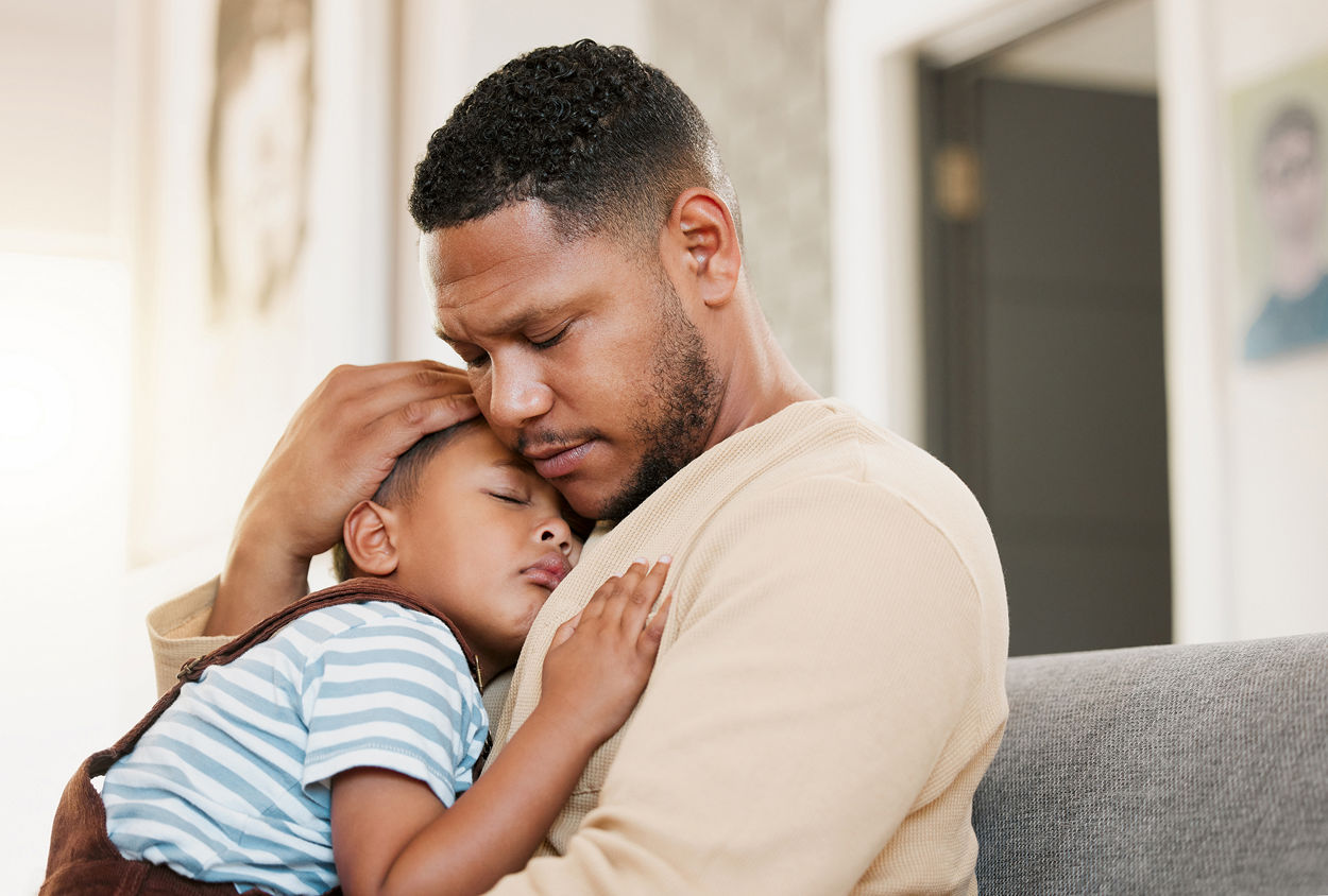 child with caring father feeling stress and worry