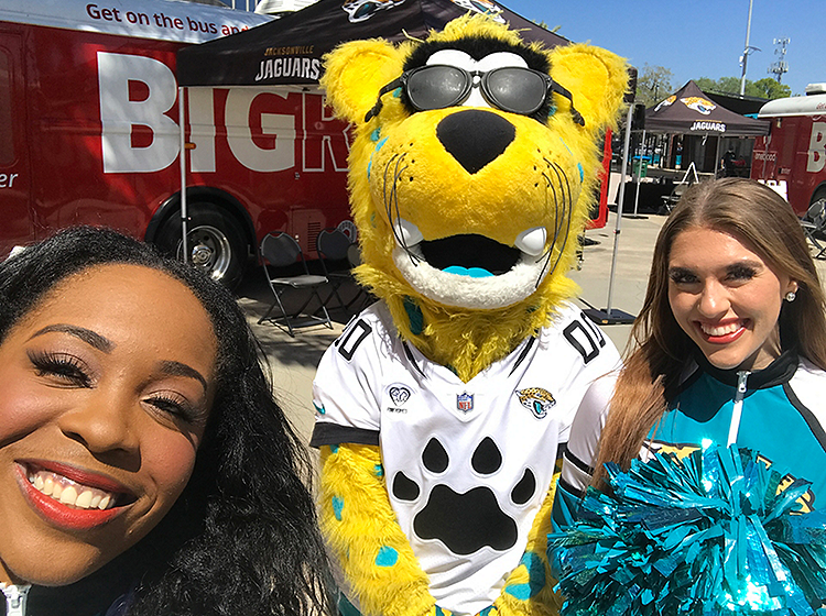 Jacksonville Jaguars blood drive, cheerleader with Jaguars mascot
